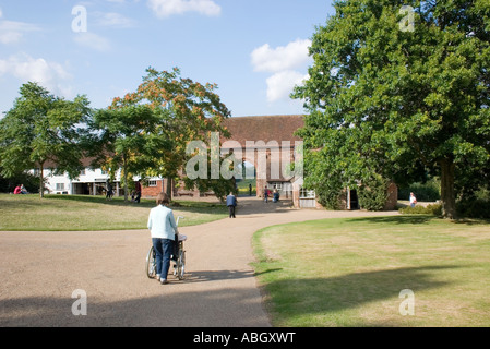 Disabled Visitor in Wheelchair at Sissinghurst(Taken from Public Footpath) Stock Photo