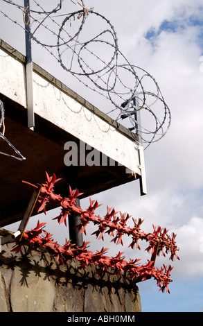 Razor wire security measures on run down shopping centre on Gurnos Estate Merthyr Tydfil South Wales UK Stock Photo