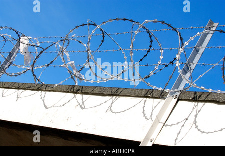 Razor wire security measures on run down shopping centre on Gurnos Estate Merthyr Tydfil South Wales UK Stock Photo