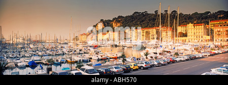 Port of Nice lined by old houses and filled with new yachts Stock Photo