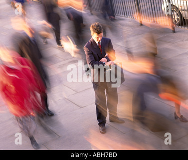 Businessman looking at watch Stock Photo