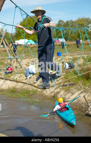 Scouting Rope Bridge Scouts and scout leader crossing a rope bridge over a river Stock Photo ...