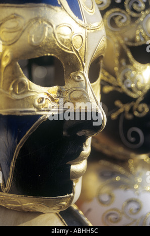 Close up of gold and blue full face carnival for Mardi Gras carnival for sale near Lido St Mark s Basin Venice Italy Stock Photo