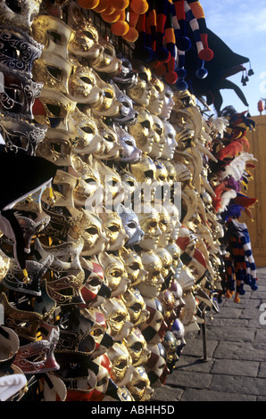 Venice carnival mask and hat stall for Mardi Gras carnevale near Lido in Venice Italy Stock Photo