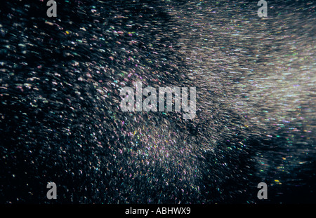 Diamond Dust or Ice Snow crystal flow visualization in freezer chamber Stock Photo