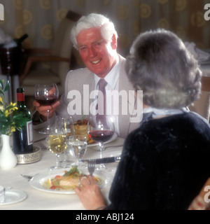 MATURE COUPLE DINING OUT IN RESTAURANT. MODEL RELEASE AVAILABLE IF REQUIRED. Stock Photo