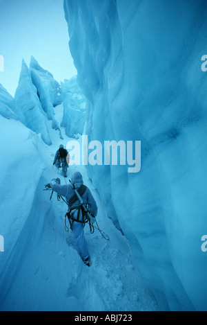 Mountain and arctic soldier wearing camouflage in the snow and ice of the arctic on exercise in the winter Stock Photo