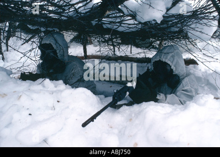 Camouflaged soldiers in snow and ice in the arctic Stock Photo