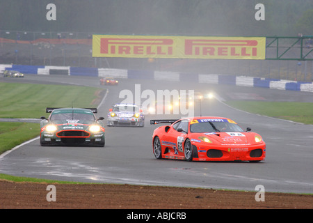 Cars Nos 62 Ferrari 430 GT2 and 24 Aston Martin DBR9 FIA GT Championship Round 1 Silverstone May 2006 Stock Photo