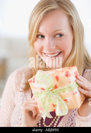 Woman holding gift Stock Photo