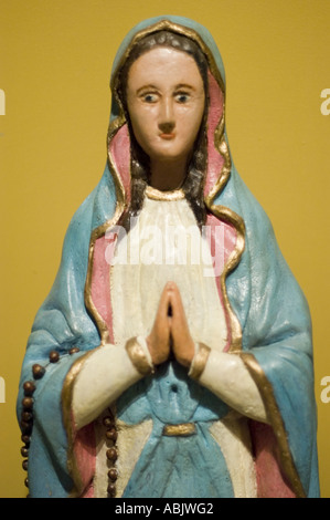 Traditional Polish Roman Catholic statue of Virgin Mary praying with a ...