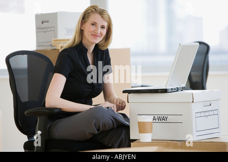 Businesswoman in new office Stock Photo