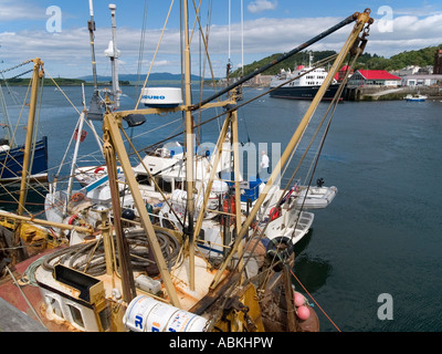 Fishing and tourist pleasure boats in Oban harbour, with a moored Caledonian Macbrayne inter island ferry in background. Stock Photo