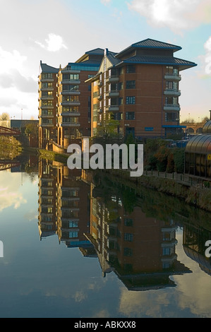 HM Customs and Excise buildings, Ralli Quays, reflected in the river Irwell, Salford, Manchester, England, UK Stock Photo