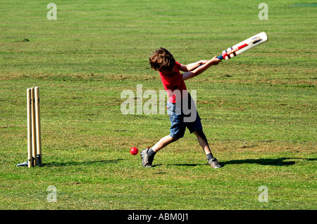 young boy batting in a game of cricket Stock Photo