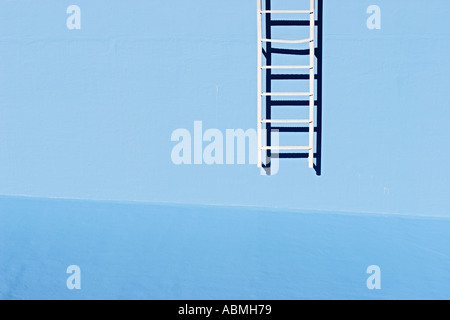 Ladder At Wall Of Empty Swimming Pool Stock Photo