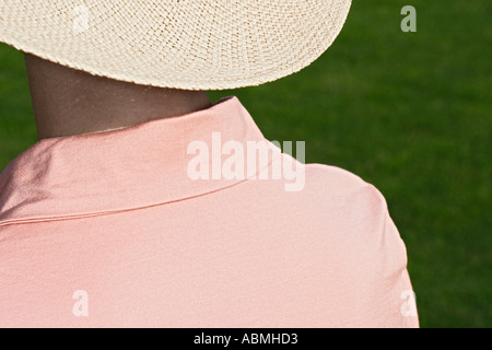 Woman Wearing Straw Hat In The Sun Stock Photo