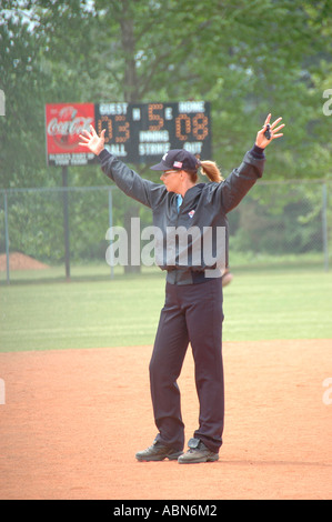 New softball umpires for ASA organization in USA and America during games and in pregame checking bats and lineups and rules and such for team games Stock Photo