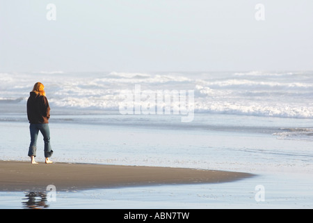 Woman Walking on Beach, Humboldt Coast, California, USA Stock Photo