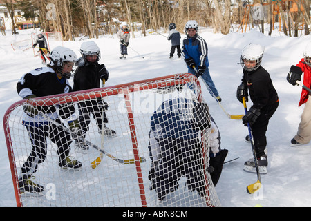 Children Playing Hockey Stock Photo