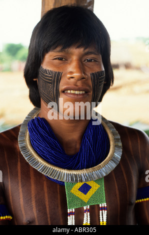 A-Ukre village, Brazil. Bengoti, Megranoti- Kayapo warrior wearing the Brazilian flag in bead work; Xingu Indigenous Area, Para state. Stock Photo