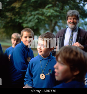 Schoolboys schoolchildren and science teacher on a school visit to a forest woodland Country Park Llandeilo Carmarthenshire Wales UK   KATHY DEWITT Stock Photo