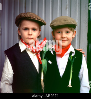 Welsh school boys children wearing leek on waistcoat celebrating (Saint David) St Davids Day at Llanwrda Carmarthenshire Wales UK  KATHY DEWITT Stock Photo