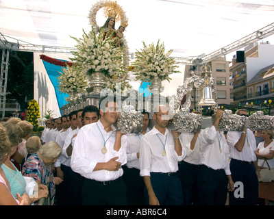 Fuengirola feria begins with an outdoor Catholic mass in honour of the Virgin Mary Costa del Sol Spain Stock Photo