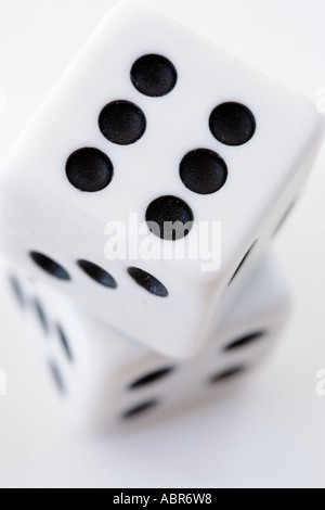 Pair of white dice on top of each other Stock Photo