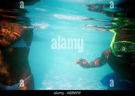Couple underwater in swimming pool Kwa Zulu Natal South Africa Stock Photo