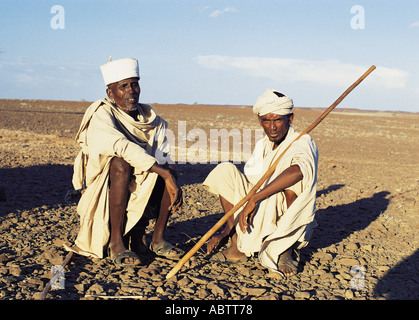 Two Gabbra men sitting and chatting Chalbi Desert northern Kenya Stock Photo