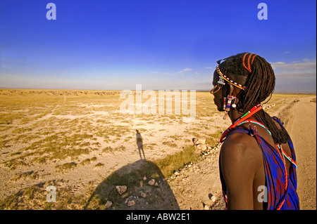 Maasai people Maasai guide looking for animals in the park Model Released Amboseli National Park Kenya Stock Photo