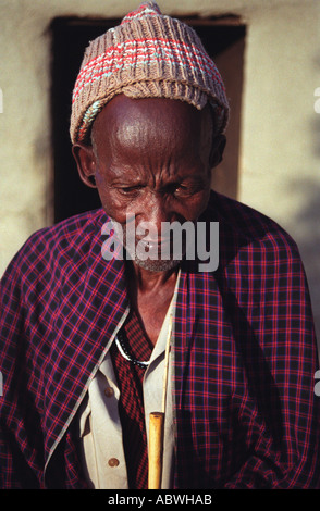 Maasai elder in his traditional robes Shambarai Tanzania Stock Photo