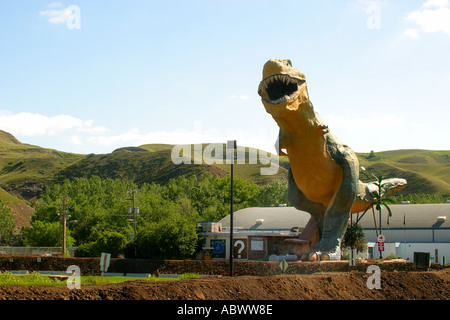 TYRANOSAURUS REX meat eater Dinosaur Prehistoric Park animal sculptures inland sea and volcanic mountains Stock Photo