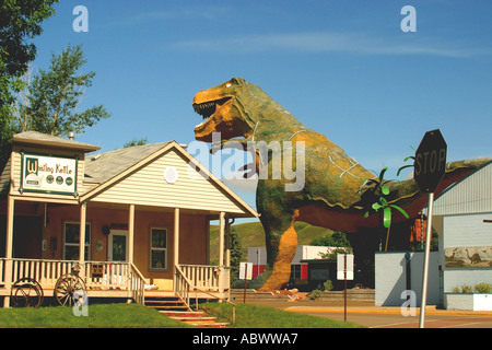 TYRANOSAURUS REX meat eater Dinosaur Prehistoric Park animal sculptures inland sea and volcanic mountains Stock Photo