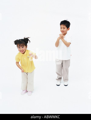Boy and girl standing together Stock Photo - Alamy