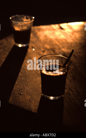 Two cups of black coffee on table in warm late afternoon light in Tunis Tunisia North Africa Stock Photo