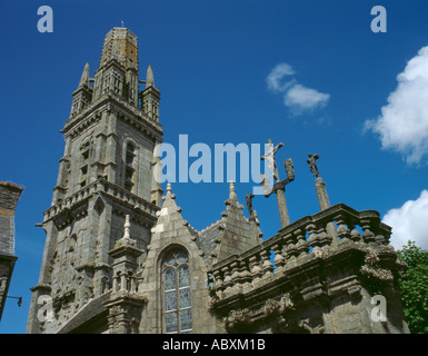 Entrance Calvaire and Church spire, Lampaul-Guimiliau, near Landivisiau, Bretagne (Brittany), France. Stock Photo