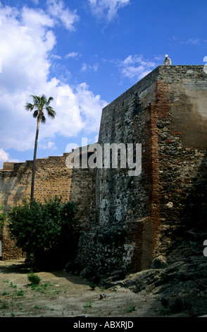 Tourist on the defensive walls of the ancient Castillo de Gibralfaro on the hill above Málaga on the Costa del Sol Spain Stock Photo