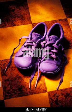 Pair of blue shoes on checkered floor Stock Photo