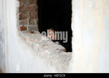 Child on building site Hyderabad Andhra Pradesh India Stock Photo