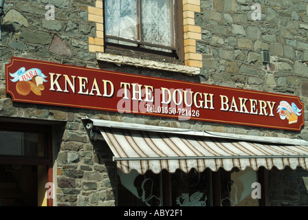 Humorous fascia sign over bakers shop Knead the Dough Stock Photo