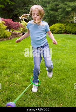 Child playing skip it Stock Photo
