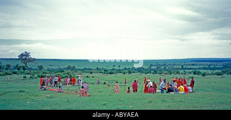 AFRICA KENYA Masai Mara National Reserve Panoramic view of African savanna Masai tribe sets up market to sell beaded jewelry Stock Photo