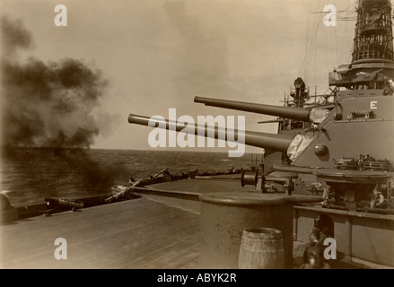 Twelve inch gun fire on USS Arkansas BB-33, a Wyoming class battleship and the third ship of the United States Navy. Stock Photo