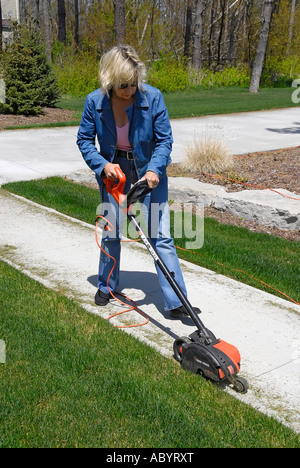 Adult Female Uses Power Electrical Edging Tool To Enhance The 