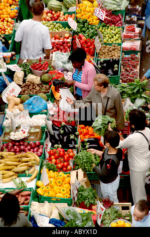 food on sale on market stall market stall fruit vegetable veg surrey street market croydon surrey fresh vitamin mineral rou Stock Photo