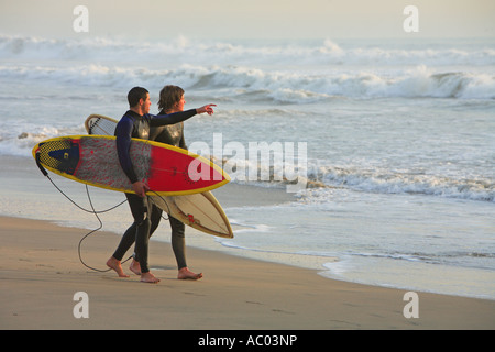 Surfers walking   Hunington Beach Orange County California United States MR Stock Photo