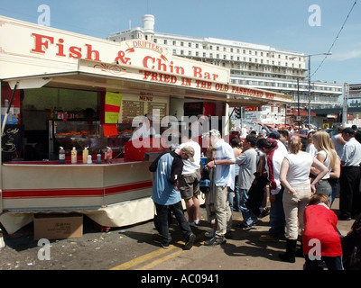 Street Food Fish and Chips fast food mobile portable bar & group of people queue to be served at outdoor event day Southend on Sea seafront Essex UK Stock Photo