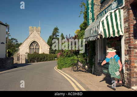 Wales Glamorgan Llantwit Major Church Street Alan Youngs traditional butchers and St Illtyds church Stock Photo